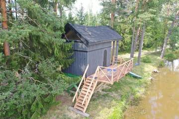 Фото номера Дом с 1 спальней Дома для отпуска Dragon house in the tree! Jacuzzi, Sauna , Apkure! г. Līči 68